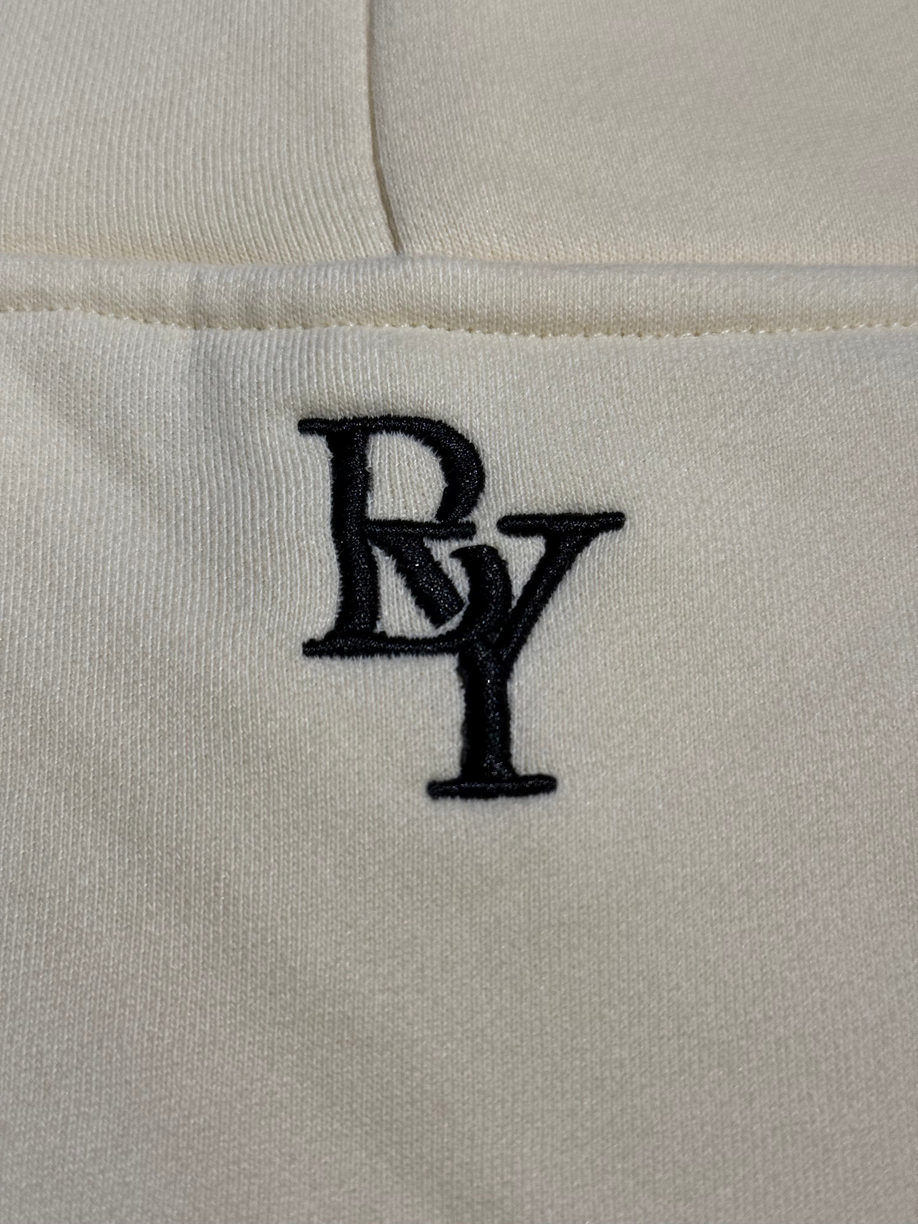 Beyond Elite Hoodie Apricot - Close-up of logo