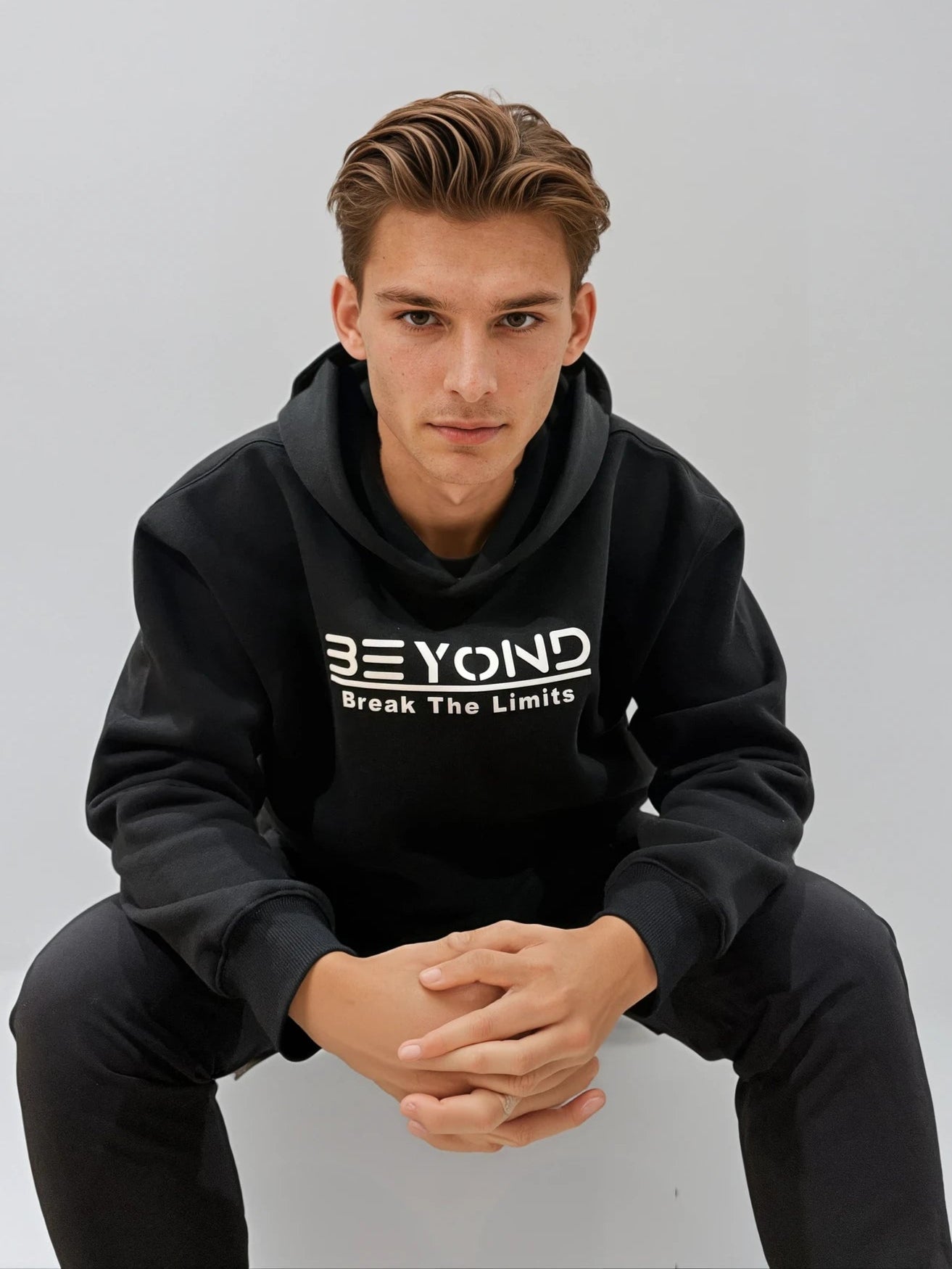 Beyond Elite Hoodie Stealth Black - Lifestyle view showing minimalist design